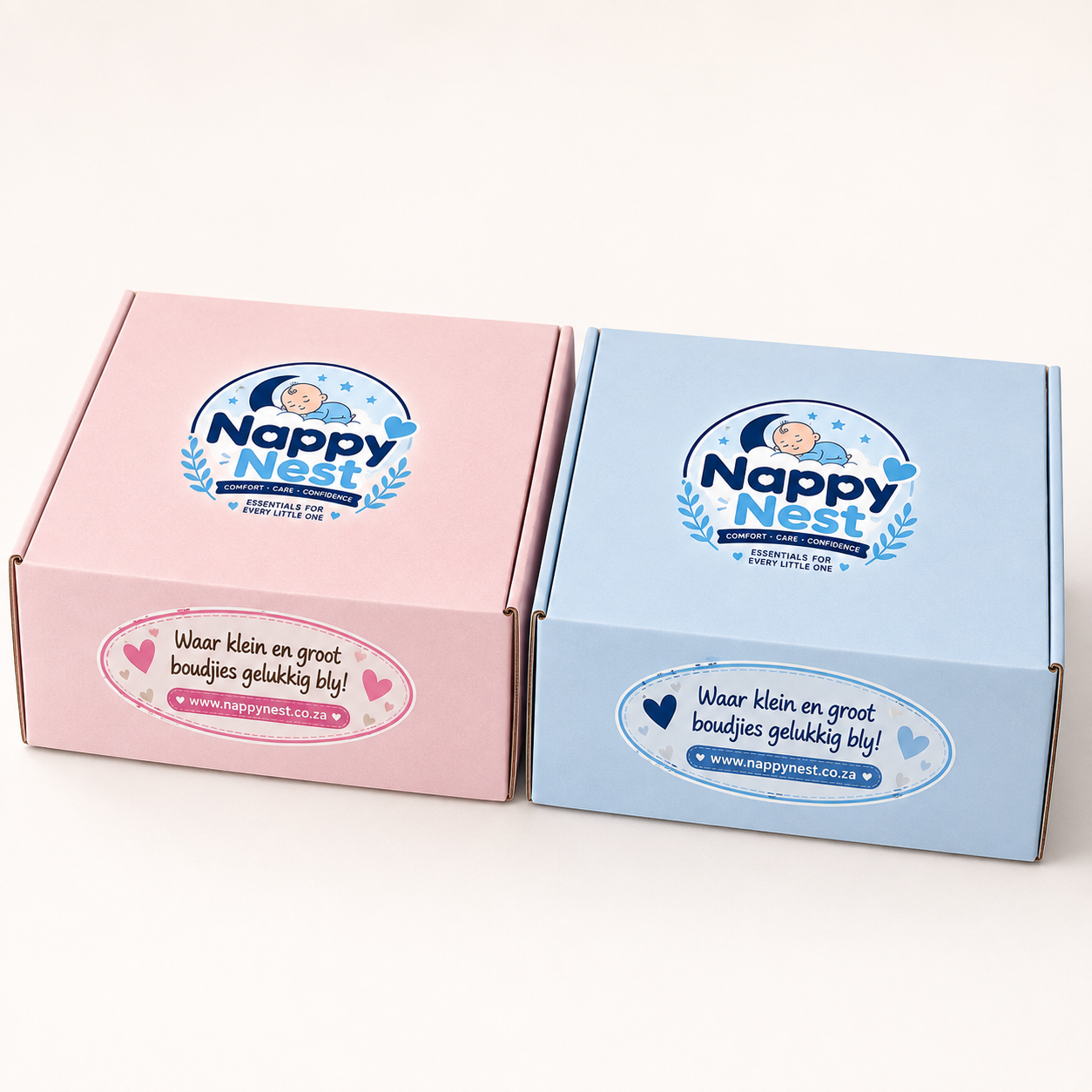 Nappy Nest gift boxes — pink and blue branded boxes ready to gift